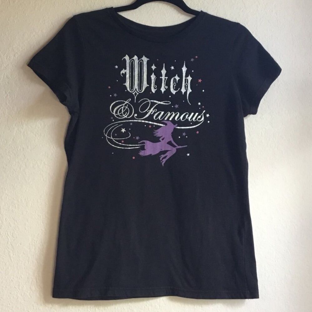 Witch and Famous witchy black tshirt witch on a broom stars gothic font